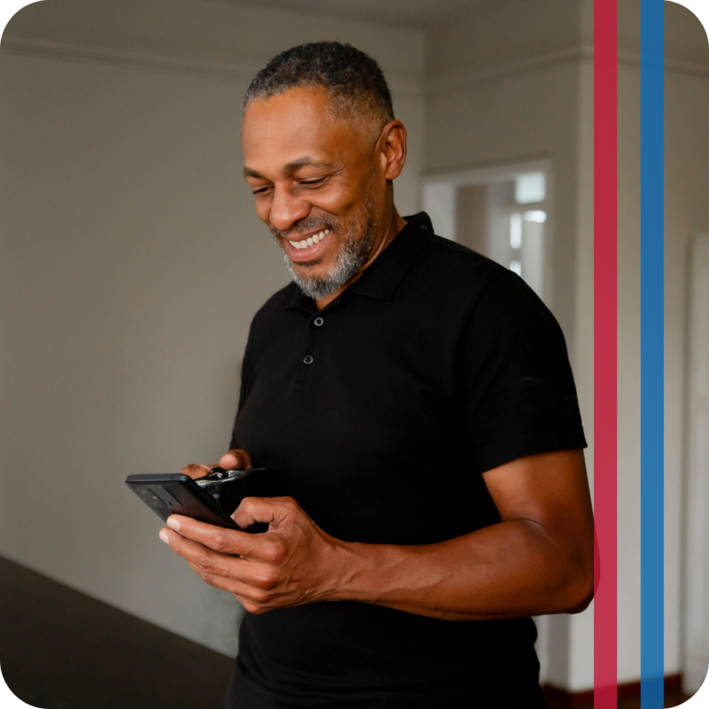 man using smart thermostat on phone