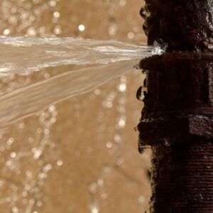 Water spraying from a burst pipe