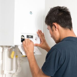 Person fixing a boiler